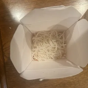Fried rice noodles in the bottom of fried chicken container to help profits
