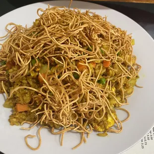 a plate of noodles and vegetables