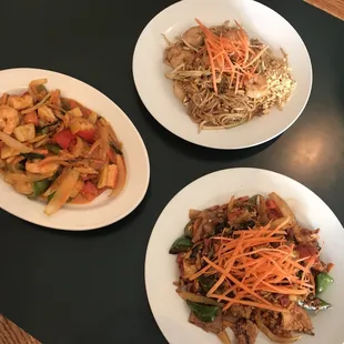three plates of food on a table