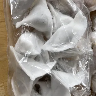 a pile of dumplings wrapped in plastic