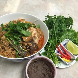 Kow Boun ( vermicelli noodles in fish based broth) with side of fresh veggies and shrimp paste to dip my peppers with.