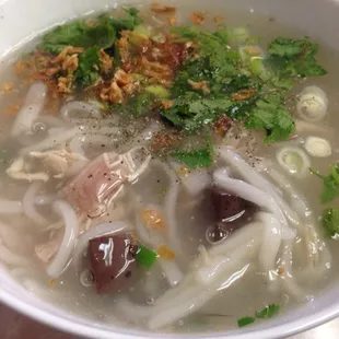 Kow piak with noodles, coagulated blood, and chicken exposed