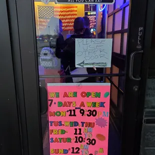 a sign in the window of a restaurant