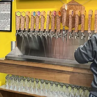 a row of beer taps