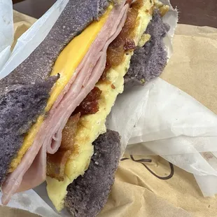 Harley Quinn- super soft freshly made bagels. Fluffy egg, crispy bacon, ham and cheese sandwich.