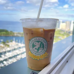 a cup of coffee on a window sill