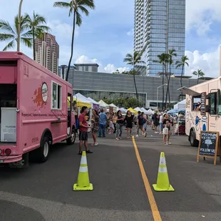 ood trucks lined up in a parking lot