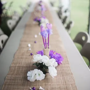 Tables and the chairs, my friends sets the decorations on the table.