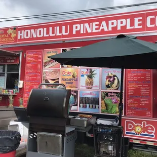 a food truck selling pineapples