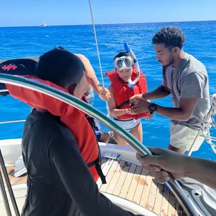 Capt showing my daughter the sea urchin!