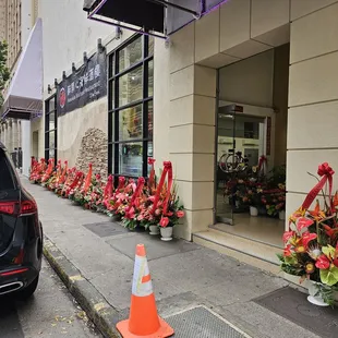 The entire storefront was lined with Congratulatory bouquets!