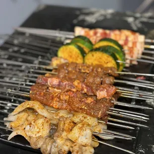 a variety of meats on a grill