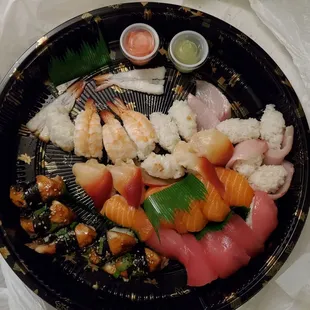 UberEats Takeout. &quot;ALOHA PLATTER&quot;. This I how it looked when I got it. Sushi was warm. Gave us stomach problems all night. 30 pieces.