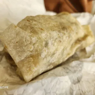 Thick breakfast burrito with sausage.