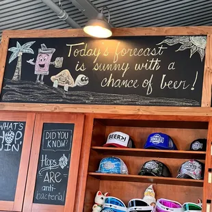 a chalkboard with a sign that says today is sunny with a chance of beer