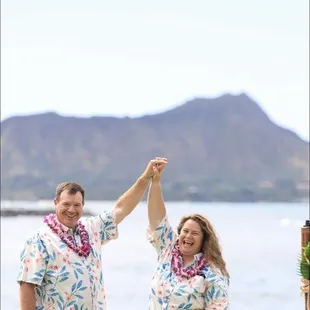 Married Couple holding up their Arms in a Cherish