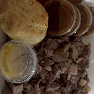 The box of chopped brisket and some sort of roll.