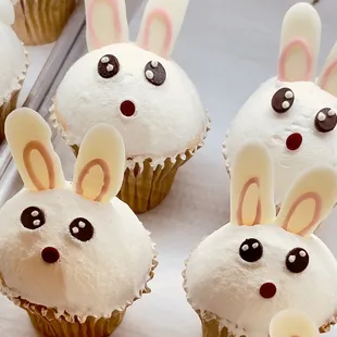 a bunch of cupcakes with bunny ears