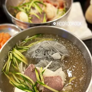 a bowl of soup with meat and vegetables