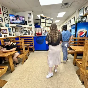 a woman in a white skirt and a man in a blue shirt