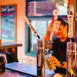 Bar tender pouring beer