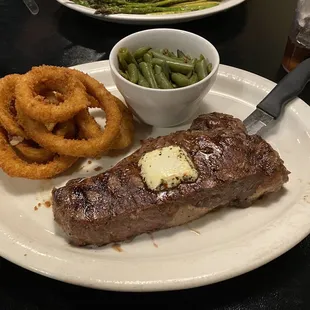 KC Strip with green beans w/ bacon &amp; onions, onion rings.