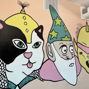 a mural of a cat and a clown