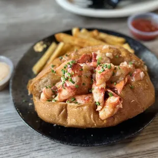 Lobster Roll (4oz) and Cajun fries!  5/5 absolutely delicious.