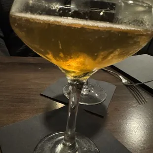 a glass of beer on a table