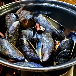 Smoked Clams &amp; Mussels with dried chorizo, scallions, Mexican lager, coconut milk, toasted baguette