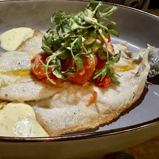Whole Branzino with confit of cherry tomato, Fresno chili, &amp; pearl onio, artichok, pea shoot, sherry vinaigrette, tarragon aioli
