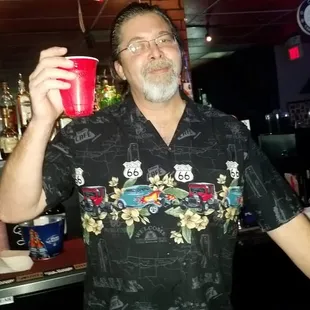 a man holding a red cup