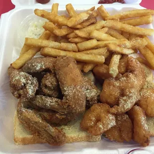 Wing and shrimps with fries.