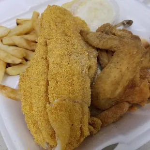 Lunch special Fried chicken and Fish with french fries.