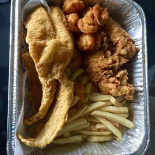 Fish, chicken, shrimp and fries.