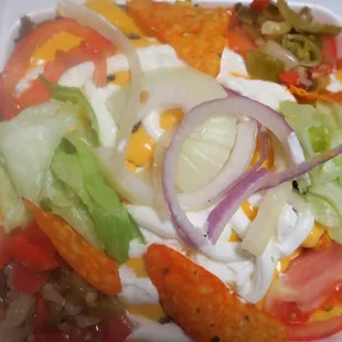 a salad in a styrofoam container