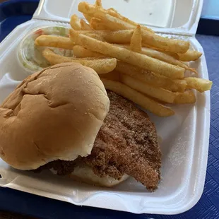 Chicken sandwich with fries and cole slaw