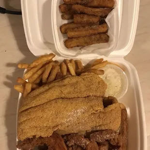 4 piece jumbo shrimp with 2 piece catfish and fries and an order of zucchini fries