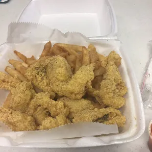 a container of fried fish and fries