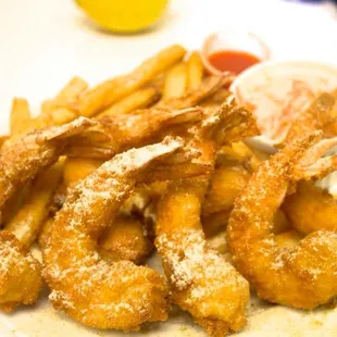 a plate of fried fish and fries