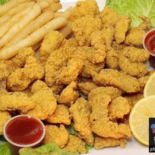 a plate of fried fish and fries