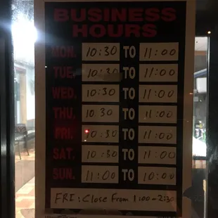a business hours sign