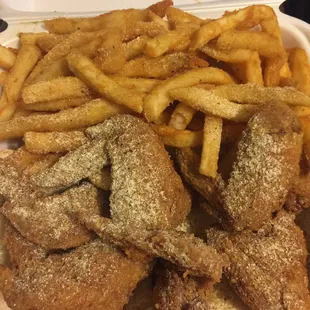 Wings with extra seasoning and fries