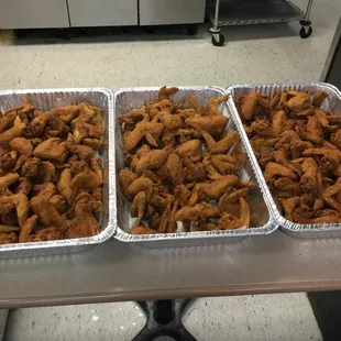 three trays of fried chicken