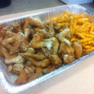 Party platter with 40 whole wings and coated fries with hook's lemon pepper seasoning