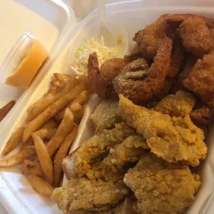 a container of fried fish and fries
