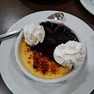 Creme Brulee with mixed berries and whipped topping