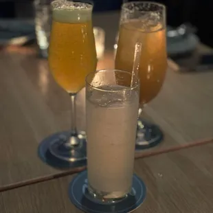 two glasses of beer on a table