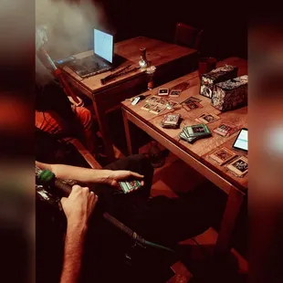 a person sitting at a table with a laptop