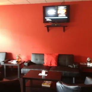 a living room with a flat screen tv